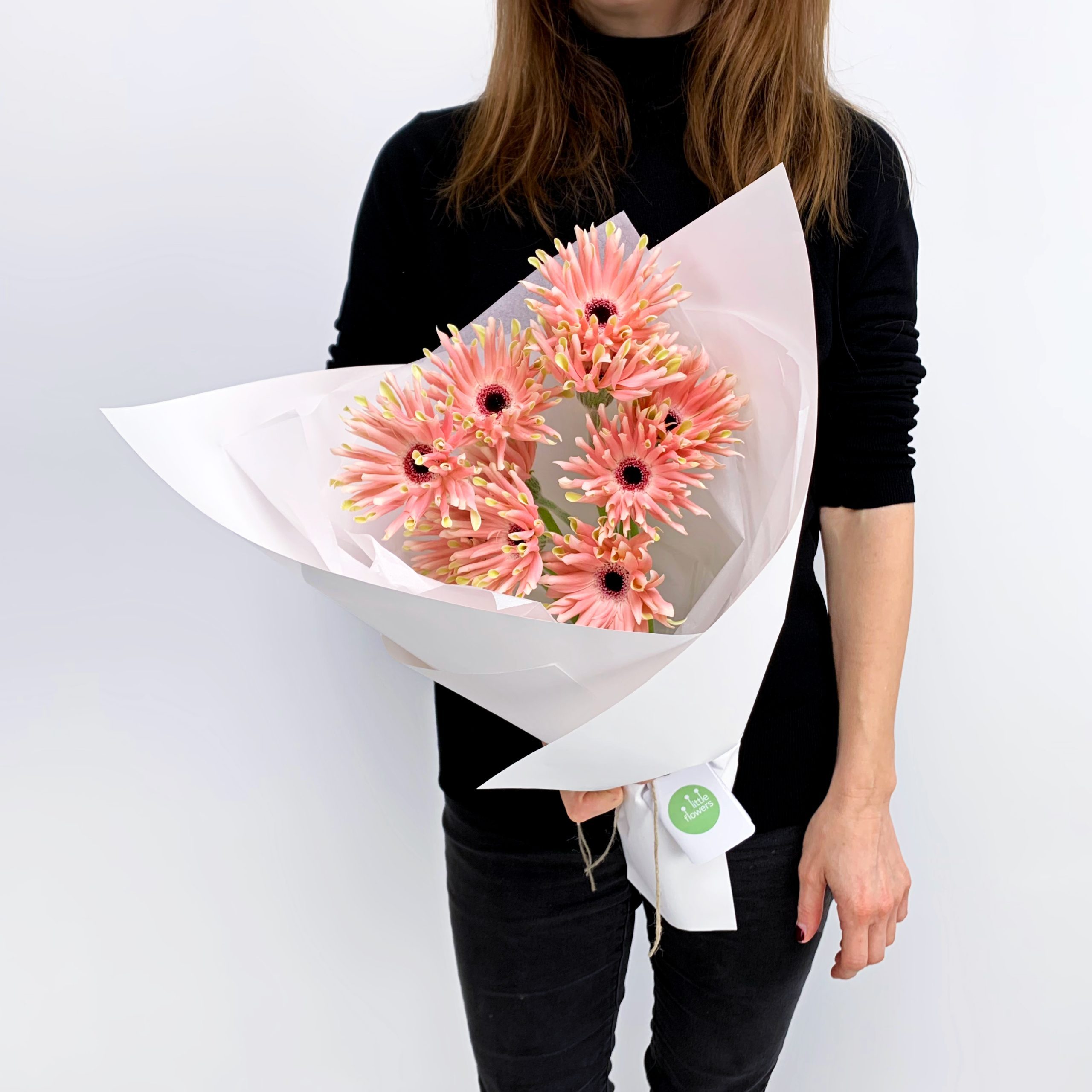 Bouquet of pink Noodle Gerberas, wrapped in white paper - Sydney flower delivery