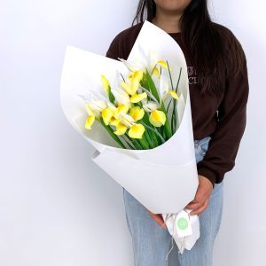 Small bouquet of yellow iris in white wrapping – Sydney flower delivery