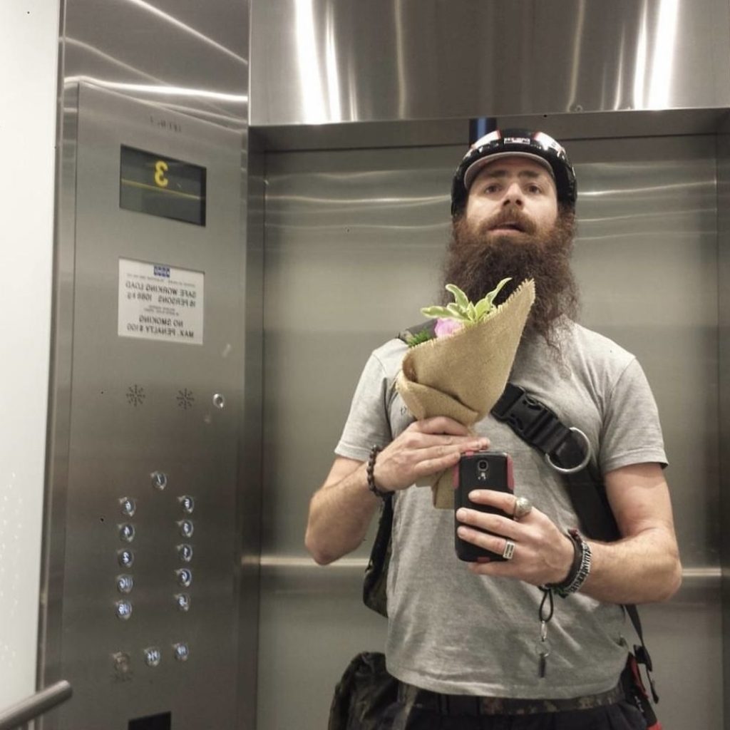 courier delivering flowers in office lift Sydney CBD