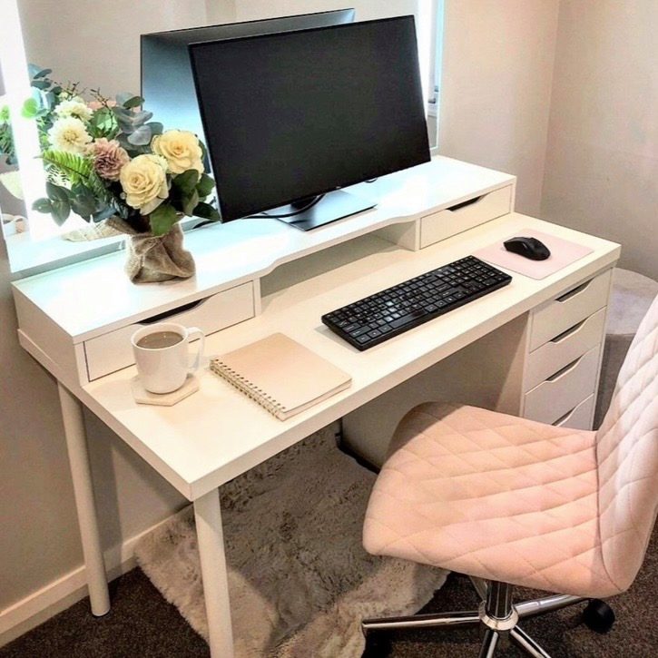 Flowers placed on a desk to brighten a workspace